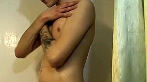 inked gay teen masturbating and fucking his ass with dildo in shower