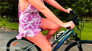 wife rides her bike in public, flashing cleavage and big tits on a dare