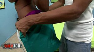 ebony goddess showcasing giant natural boobs in a scene