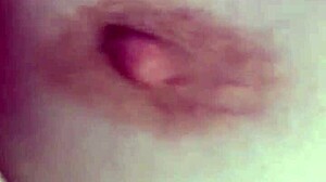 Slut drips red, cums with toy at party.