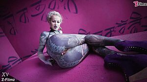 Tattoo goth punk babe fingers solo, showing off anal gapes with buttplug collection