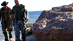 Latina Mom Rides Cock on Beach While Fingering Her Shaved Pussy. What a Wild Handjob in Fishnets!