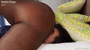 black short-haired amateur licks pussy in bedroom shorts.