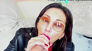 Hot milf makes blowjob in glasses for homemade fun.
