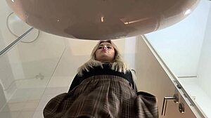 Hot Blonde Babe in Pantyhose and Heels Strips in Bathroom Miniskirt