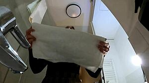 Hot Blonde Babe in Pantyhose and Heels Strips in Bathroom Miniskirt