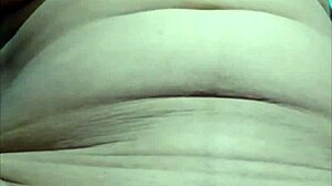 She lifts her ghunghat to touch her pussy.