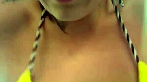 Amateur gets soaking wet pussy training in thong bikini at beachfront gym.