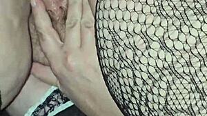 Sexy MILF in Fishnets Spreading Her Ass Cheeks Seductively