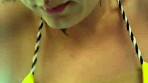 Amateur gets soaking wet pussy training in thong bikini at beachfront gym.