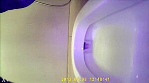 Hidden camera shows asian teen using the bathroom discreetly