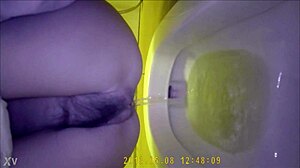 Hidden camera shows asian teen using the bathroom discreetly