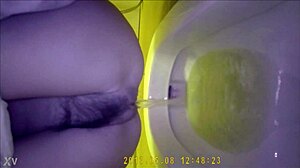 Hidden camera shows asian teen using the bathroom discreetly