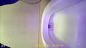 Hidden camera shows asian teen using the bathroom discreetly