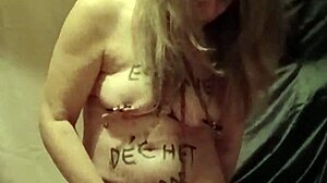 Slave endures self-bondage and wax play outdoors