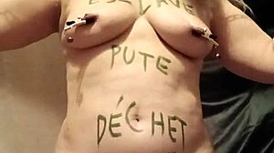 Slave endures self-bondage and wax play outdoors