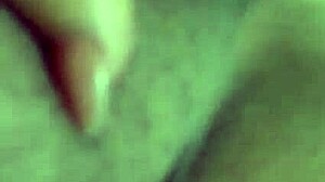 alone at home, she indulges in some private masturbation with her shaved pussy