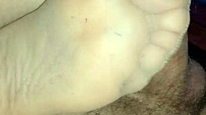 Homemade sensual footjob with tan stockings turns into teasing fun