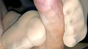Homemade sensual footjob with tan stockings turns into teasing fun