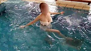 Stunning brunette works out solo in pool with sexy moves!