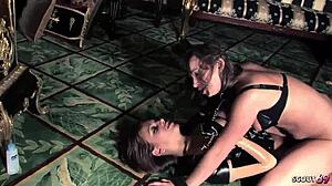 Lesbian domina controls teen 18+ in rough latex BDSM with strapon domination session