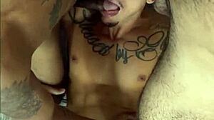 Two well-endowed men fucking the pretty twink in a fetish session