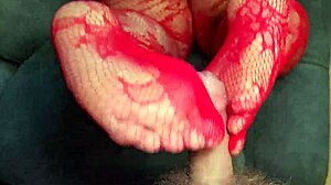 chubby wife in red stockings gives footjob to neighbor.