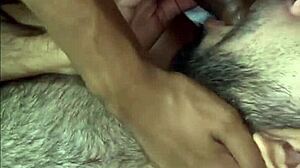 Two well-endowed men fucking the pretty twink in a fetish session