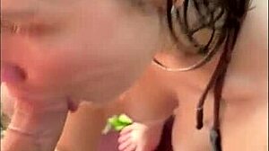 Horny teen in bikini gives oily titjob and blowjob on beach