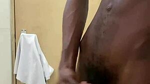 a guy busts a nut in public bathroom with huge black cock