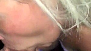 Mature blonde engages in deepthroat with big black cock