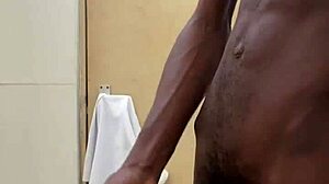 a guy busts a nut in public bathroom with huge black cock