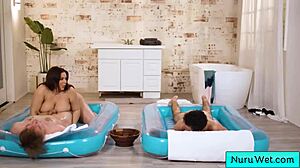 Sexy busty masseuse handles two clients!