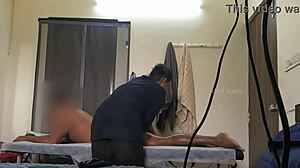 a guy flashes his cock to a spa girl during an ass massage