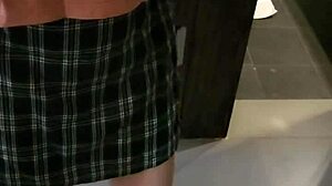 Shemale ladyboy seductively poses and flirts before the mirror.