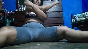 Very sexy Mexican brunette has a big ass working out in fishnets
