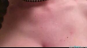 Pigtailed brunette playing with her big tits