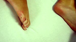 The innocent beauty moans while touching her pussy at bedtime