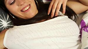 The innocent beauty moans while touching her pussy at bedtime