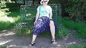 hairy mature flaunts pussy in see-through dress outdoors