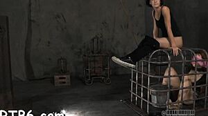 In this bondage scene, a useless floozy plays with her hairless pussy.