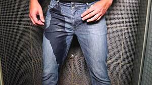 Guy pees in wet jeans and cums publicly