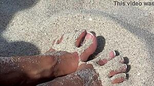 blonde milf acts as the hottest slut on the beach.