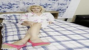 Pretty blonde in pink shows off big natural tits while squirting solo in masturbation