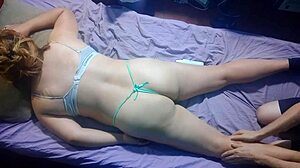 Giving massages to girlfriend in thong panties