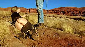 Rebel Rhyder's asshole gets whipped before rough anal in dirt and piss outdoors in western USA.