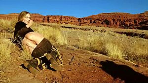 Rebel Rhyder's asshole gets whipped before rough anal in dirt and piss outdoors in western USA.