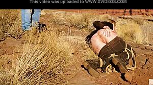 Rebel Rhyder's asshole gets whipped before rough anal in dirt and piss outdoors in western USA.