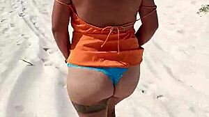 Look at her tits and ass on the beach!