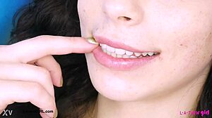 striking dark-haired stunner shows off her sexy body on the sofa